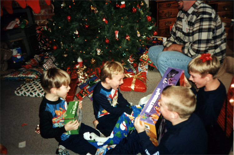 kids opening christmas gifts